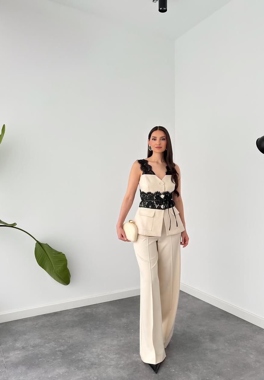 Power suit with lace detailed belt