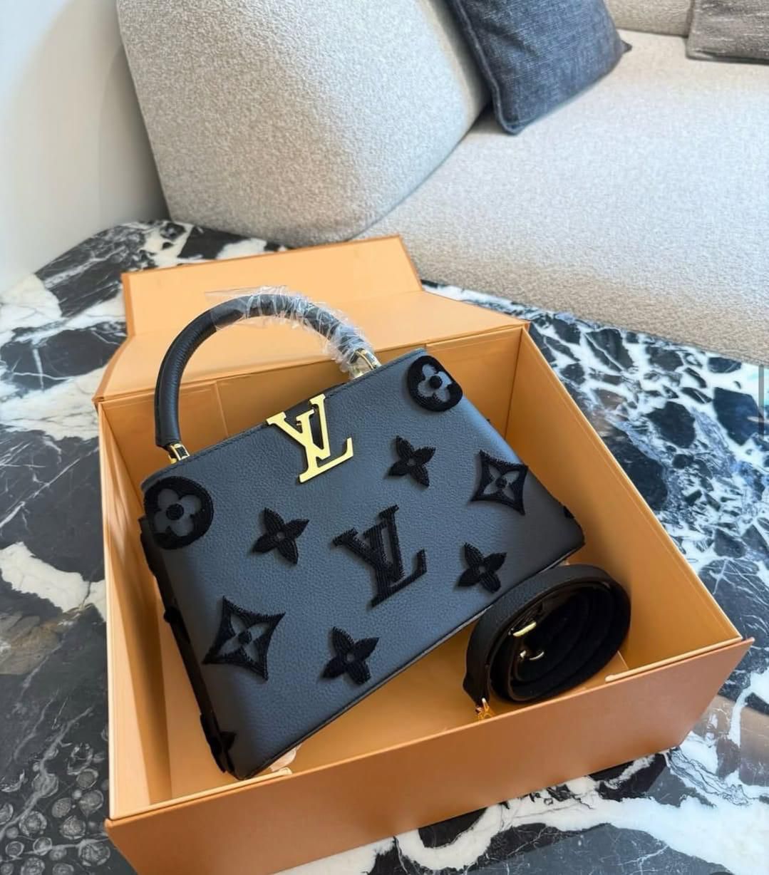 LouisVuitton Capucines in Embossed Monogram Flowers