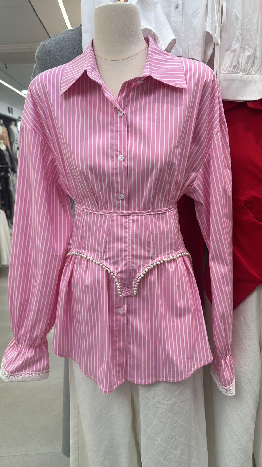 pink and white striped button-up shirt