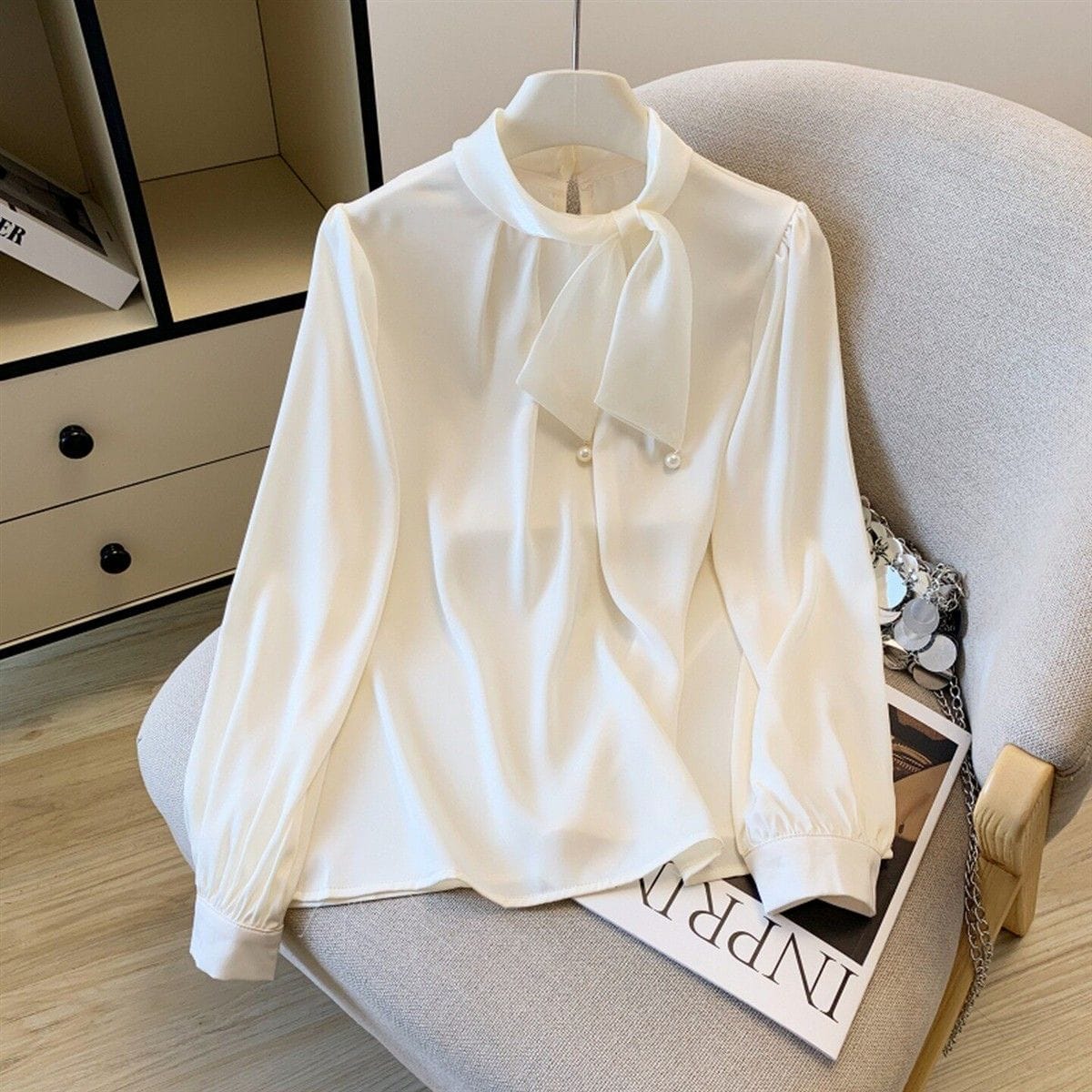 Korean-Style Satin Tie-Neck Blouse with Pearl Detailing.
