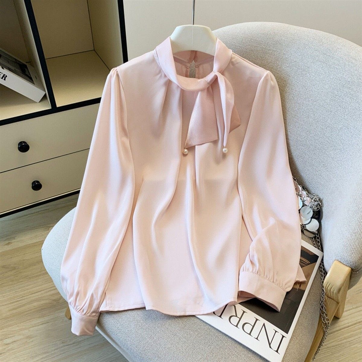 Korean-Style Satin Tie-Neck Blouse with Pearl Detailing.